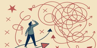 Rethinking Risk in Industrial and Manufacturing Environments Confused businessman standing at crossroads looking for solution to complex problem choosing right direction finding way out of tangled road